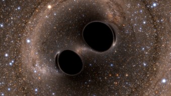 Rappresentazione artistica della coalescenza di due buchi neri. Crediti: LIGO