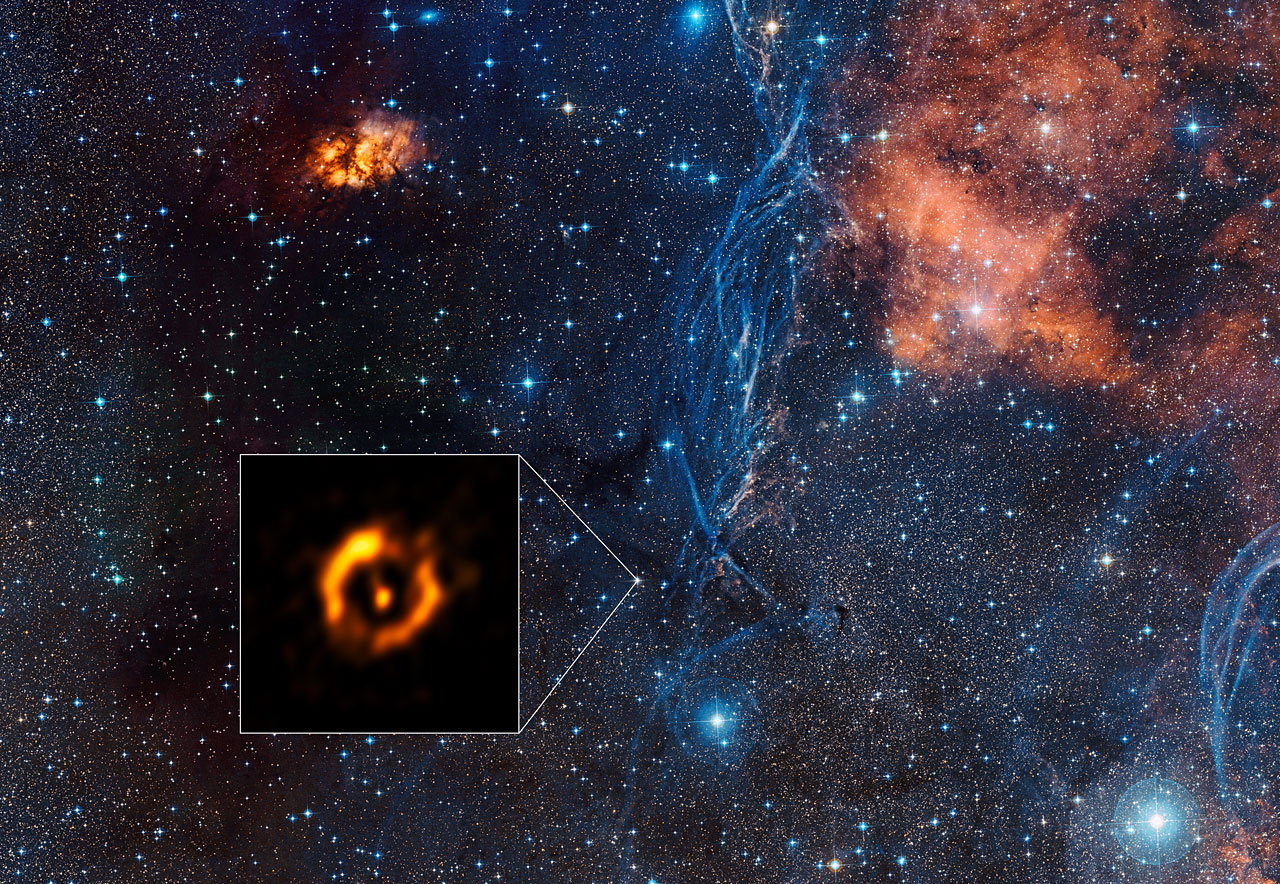 The Very Large Telescope Interferometer at ESO’s Paranal Observatory in Chile has obtained the sharpest view ever of the dusty disc around the close pair of aging stars IRAS 08544-4431. For the first time such discs can be compared to the discs around young stars — and they look surprisingly similar. It is even possible that a disc appearing at the end of a star’s life might also create a second generation of planets. The inset shows the VLTI reconstructed image, with the brighter central star removed. The background view shows the surroundings of this star in the constellation of Vela (The Sails).