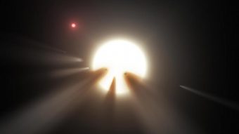 Rappresentazione artistica di una stella oscurata dai frammenti di una cometa. Una delle teorie proposte per spiegare la diminuzione di luminosità osservata in KIC 8462852 è la presenza di detriti davanti al disco stellare, dovuti a una collisione tra pianeti o la rottura di un corpo celeste di taglia planetaria o cometaria. Crediti: NASA/JPL-Caltech